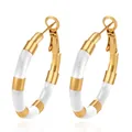 Detail of gold stainless steel bamboo hoop earrings with white enamel sections - White