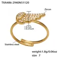 Detailed view of wing-shaped ring in 18k gold-plated steel with zircon and size 7 label - Gold Ring