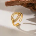 Close-up detail of a gold-toned open ring featuring micro-pave baguette-cut zircons - Full Zirconia Oval (F1160)