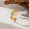 Detailed macro view of an elegant gold micro-set zirconia clover open ring for women - Double Layer White Zirconia Clover (F1244)