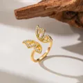 Close-up detail of a butterfly open ring micro-paved with sparkling zircons in gold finish - Rhinestone Butterfly Style (F1246)