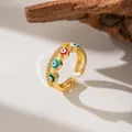 Detail shot of an adjustable gold ring with micro-pave zircons and colorful evil eyes. - Evil Eye Style (F1247)