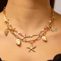 Bohemian layered gold-tone necklace featuring starfish, pearls, and real conch shell charms - Multi-layer Marine Layering Necklace (3549)