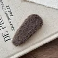 Close-up of deep brown plush BB hair clip with soft faux fur texture for women - Coffee Gray