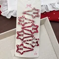 Set de seis pinzas para el cabello en forma de estrella con patrones rojos vivos - Estrella De Cola Larga
