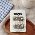 Detail of floral fabric hair clips with white lace edges and pearl accents on card - Gray Lace BB Clip