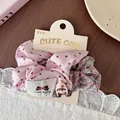 Detailed shot of pink polka dot and plaid hair scrunchies set on display card - Pink Polka Dot