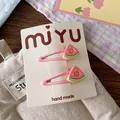 Detail of pink watermelon fruit hair clips set on a handmade display card - Watermelon