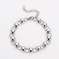 Primer plano de la pulsera de campana minimalista de acero inoxidable con cuentas huecas - 18.5cm / Color acero