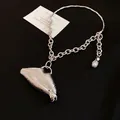 Detailed view of heavy-duty silver lip pendant necklace featuring striped texture and pearl - 3D Striped Lip Pendant (HN11704) / Silver