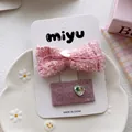 Detail of pink tweed bow hair clip with pearl heart button and glittery hair pin - 5-Square Bow Style
