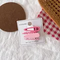 Set of four matte pink hair clips in teardrop and wave shapes on a display card - Pink Set