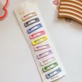 Detailed set of ten colorful macabre pastel snap hair clips on a white display card - Square / Macaron Multi-Color