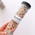 Detail of high-elastic macaron spiral hair ties in a clear cylindrical gift jar - Candy Color Threaded Style