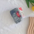 Close-up of black kids hair elastics set in a transparent box with a dog label - Solid Black