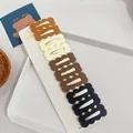 Set of 10 matte wavy hair clips in neutral tones displayed on a white card board - 3-gradient Brown Square Clouds