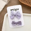 Set di due fermagli per capelli viola con fiocchi in raso e motivo pied de poule su carta - Combo Fiocco a Quadretti Viola