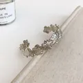 Close-up of silver floral open cuff bracelet with minimalist pleated flower design - Hollow 3D Small Flower (87#) / Silver