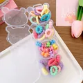 Close-up of four bear-shaped boxes with macaron colored hair ties and mini hair clips - 2-Little Rabbit Claws