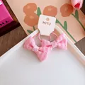 Coppia di elastici per capelli rosa a quadretti per bambina su cartoncino bianco - Elastico Per Capelli Con Fiocco A Quadri