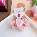Detailed view of pink chiffon bow hair ties with heart patterns on display card - Polka Dot Mesh