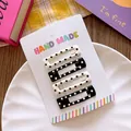 Detailed view of four polka dot hair clips displayed on a handmade paper card - Square Polka Dot