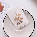 Set of 4 matte earth tone water drop BB hair clips on a white display card - Matte Water Drop Style