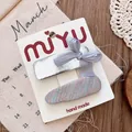 Detailed view of silver bow and woven hair clips set on handmade packaging card - Mesh Bow Hair Clip Set