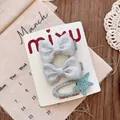 Silver glitter bow and star hair clips set on handmade white display card with lace decor - Bow and Starfish Hair Clip Set