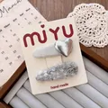 Detail of silver sequin heart clip and grey tweed bow hairpins on product card - Heart Teardrop Clip