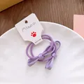 Détail de chouchous nœuds violets pour filles fixés sur des élastiques souples - Cravate à cheveux / Violet