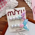 Detail of sequined mermaid tail hair clips with pearls and stars on a display card - Blue Rose Mermaid Tail Style (250358)