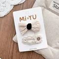 Detail of white lace bow hair clips with crochet flower and vintage button on card - Lace Bow Style