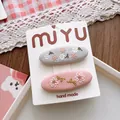 Detailed macro of handmade floral embroidery on sweet forest style fabric BB hair clips - 3-Grey-Pink Floral BB Clip Style