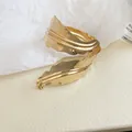 Detail showing the elegant pleated texture of the golden metal leaf open bangle. - Leaf Shape (88#) / Gold