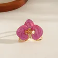 Elegant pink enamel orchid flower open bangle bracelet with golden metal finish. - Ring / Pink