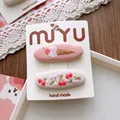 Detail of handmade embroidered hair clips with sweet cherry and ice cream patterns - 1-Ice Cream BB Clip Style
