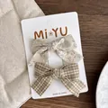 Set di due fermagli per capelli in tessuto con motivi floreali e a quadretti - Combinazione A Quadri Marrone Giallo E Floreale Beige / Fiocco Beige Verde