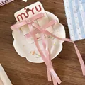 Detalle de pinzas para el cabello con lazos de satén rosa hechos a mano y borlas largas - Rosa Coreano