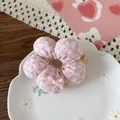 Detail of pink floral fabric scrunchie with a ribbon bow on a decorative ceramic dish - 1-Pink Polka Dot Style