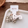 Set di due elastici per capelli da bambina con fiocco a quadretti e motivi floreali - Stili Quadretti Marrone Nero e Pois