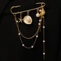 Elegante broche de estrella de mar y concha dorada con cadenas de borlas multicapa - Dorado (S497)