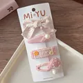 Set of four sweet pink fabric bow hair clips on a white card against a cozy background - 1-Floral Bow Set (4 Pieces)