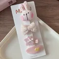 Detailed view of four sweet pink fabric hair clips with rabbit and floral embroidery - 2-Little Rabbit Set (4 Pieces)