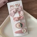 Detail of four pink fabric bow hair clips with embroidery on a white display card - 4-Plaid Bow Set (4 Pieces)