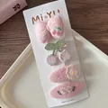 Detail view of four pink fabric hair clips with cherry and floral embroidery on cards - 5-Embroidered Cherry Set (4 Pieces)