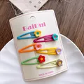 Detailed view of six colorful floral hair clips on a white display card packaging - Large Flower Style