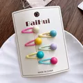 Close-up of six colorful candy-bead drip oil hair clips on a white display card - Small Round Ball Style