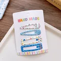 Set aus 4 blau-beigen handgefertigten Haarspangen mit Punkten und Streifenmuster - Blaue Serie