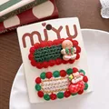 Detail view of knitted Christmas hair clips with gingerbread man and bear sock designs - Gingerbread Style